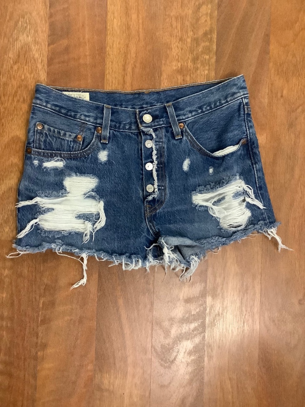 Levi’s 501 distressed button front denim shorts Small